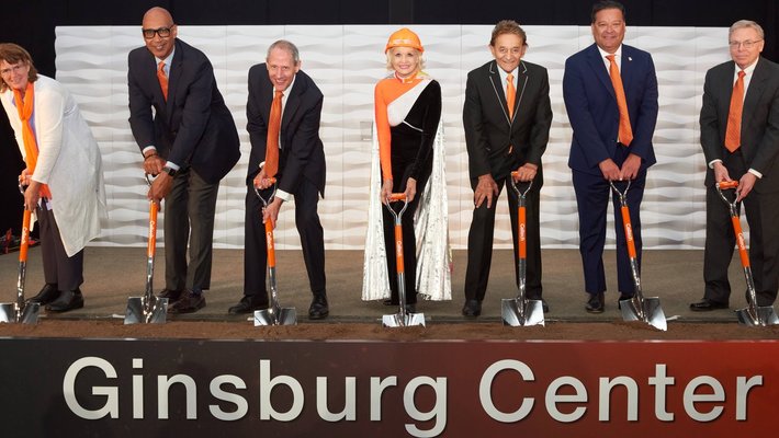 Professor Fiona A. Harrison, Assemblymember Chris Holden, President Thomas F. Rosenbaum, Charlotte Ginsburg, Allen Ginsburg, Mayor Victor Gordo, and Provost David A. Tirrell stand with shovels at a groundbreaking ceremony.