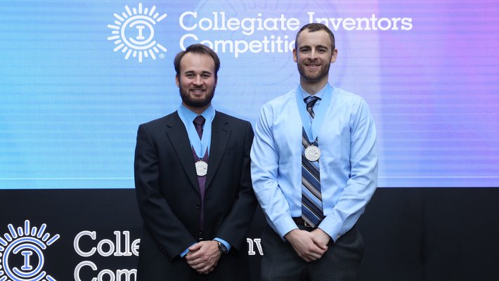 Graduate students Nathan Schoepp and recent graduate Travis Schlappi accept their award at the Collegiate Inventors Competition, held in Alexandria, Virginia, on November 3.