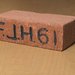 Brick with the large letters "F.J.H. '61"