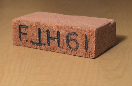Brick with the large letters "F.J.H. '61"