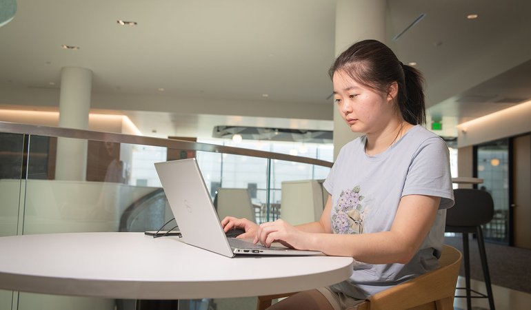 woman works at computer