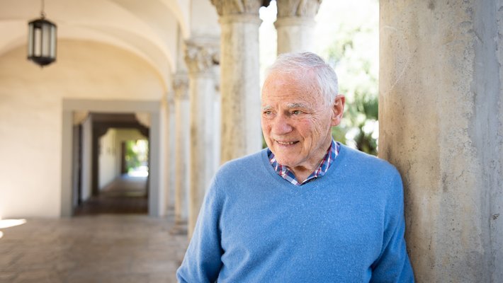 A man in a blue sweater