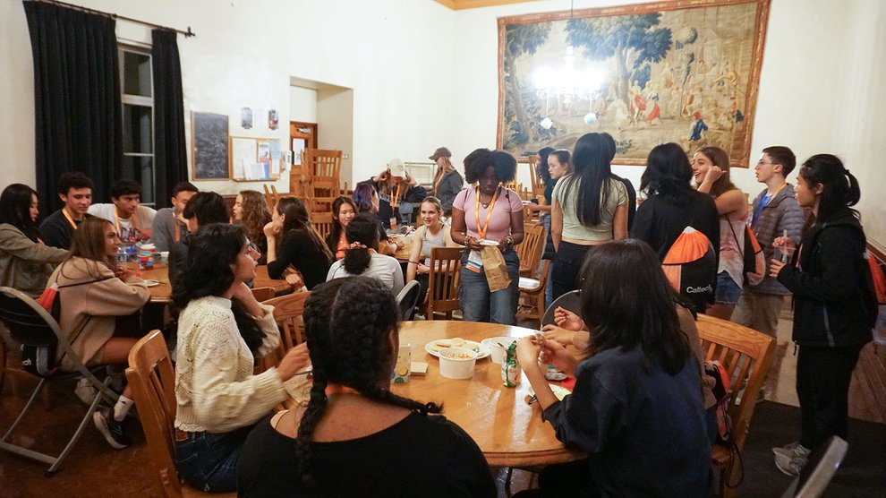 Student decorate cookies in Blacker House