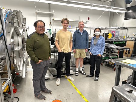 Team members standing in the lab.