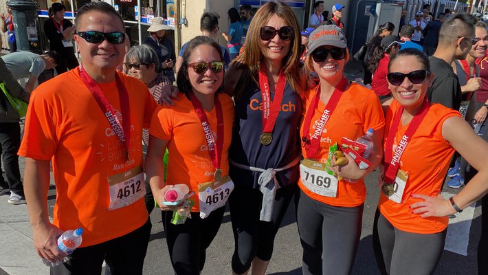 participants in the Firecracker Run wearing orange t-shirts
