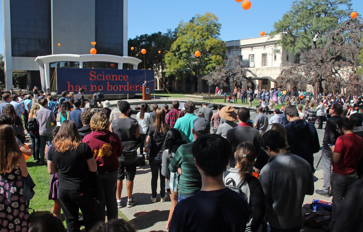 More than 500 people flocked to the March 1 gathering at Millikan Pond to support international members of the Caltech community.