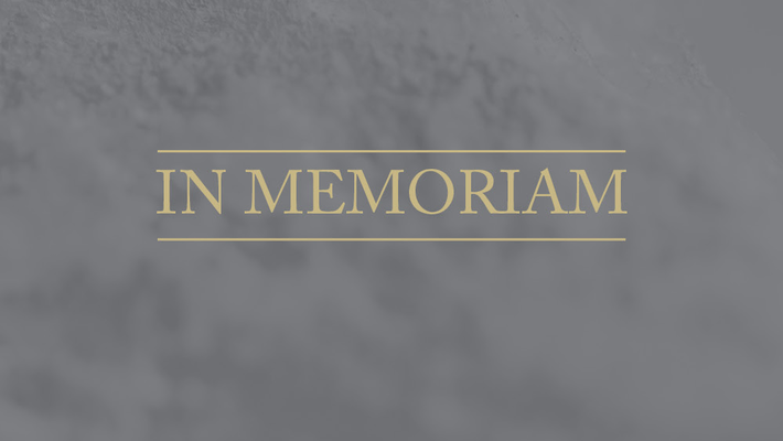 image of the words "In Memoriam" on a gray background