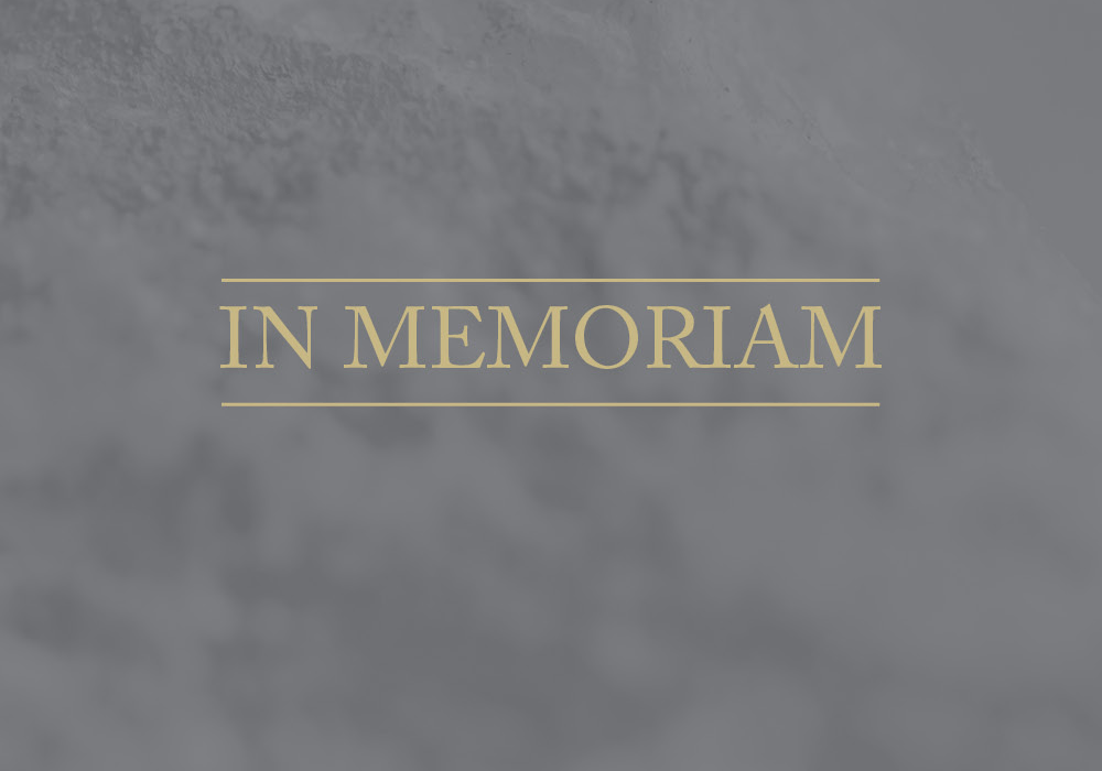 image of the words "In Memoriam" on a gray background