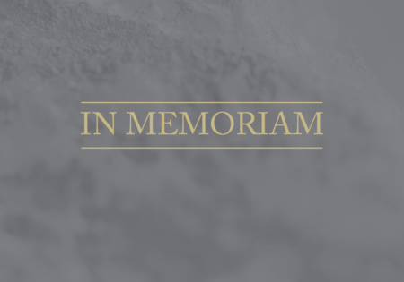 image of the words "In Memoriam" on a gray background