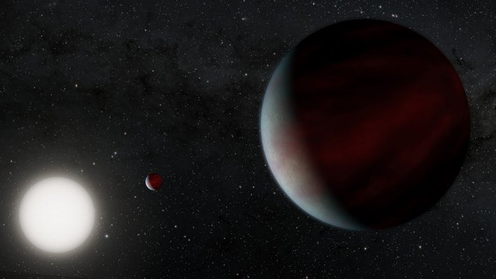 Artist's rendering of two Saturn-sized planets orbiting a Sun-like star.