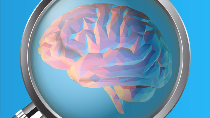 A magnifying glass examines a computer-generated brain