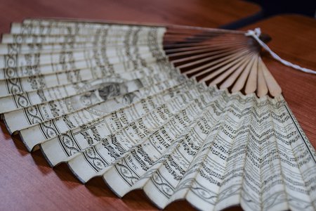 photo of a fan imprinted with music from the time period in which Austen's novels were set.