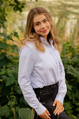 Kate Austrian smiling at the camera