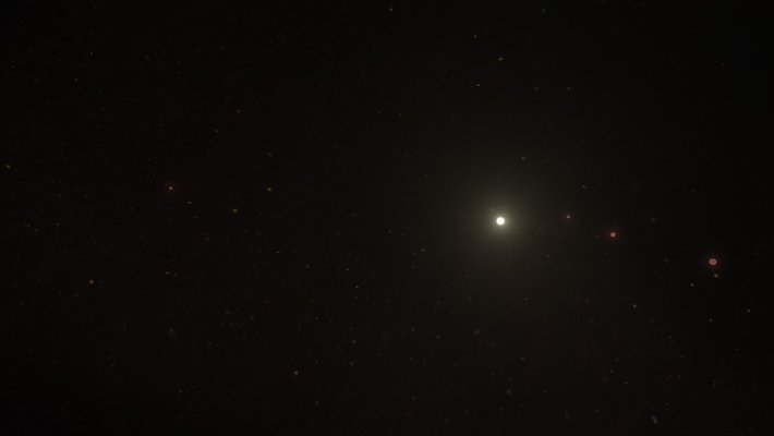 Artwork of the HR 8799 system showing a white star and four red planets.