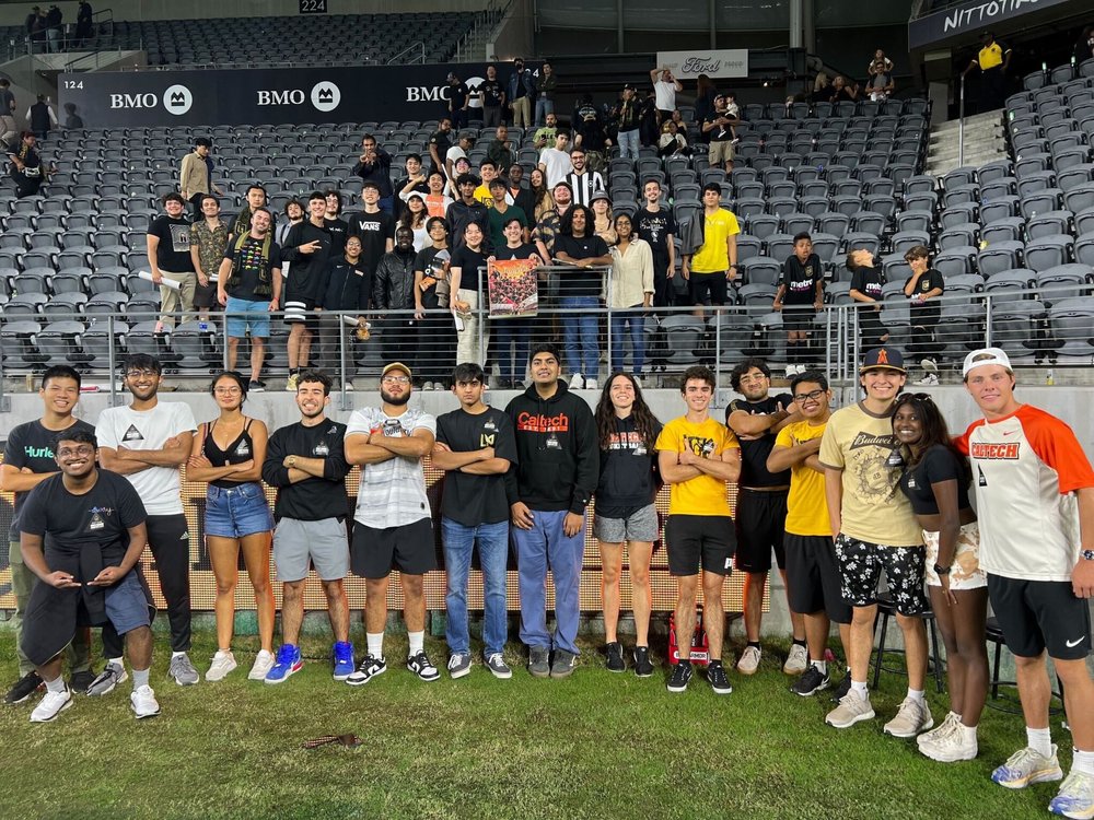 Students pose for a photo in the stadium after the LAFC match