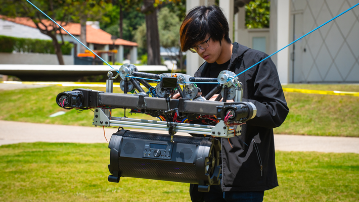 Caltech student setting up LATTICE demonstrator during a demo on campus