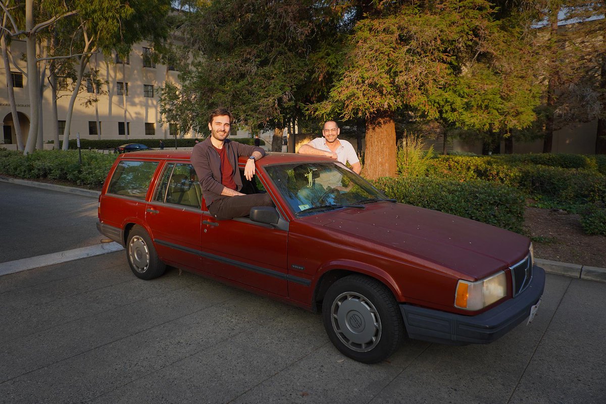 Luciano Pomatto (left) and Omer Tamuz pose in the 1995 Volvo station wagon.