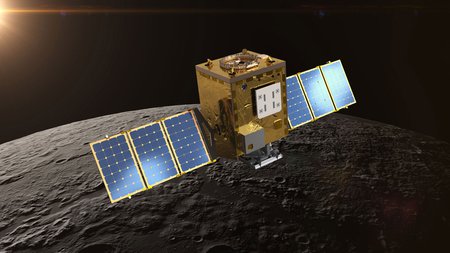 A cubic satellite with rectangular solar panels extending to the left and right. In this artistic rendering, the spacecraft orbits the Moon.