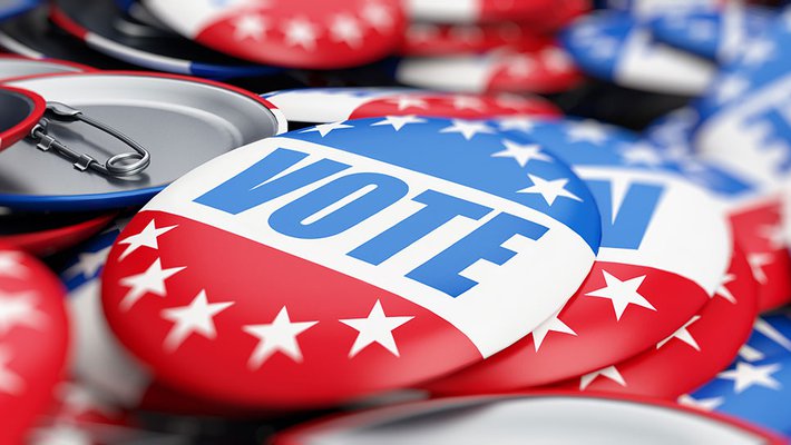 An image of red, white, and blue buttons reading "vote."