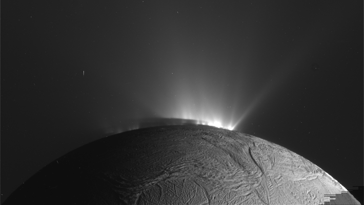 Black and white image of a gray sphere with bright white cone emitting from the sphere's surface