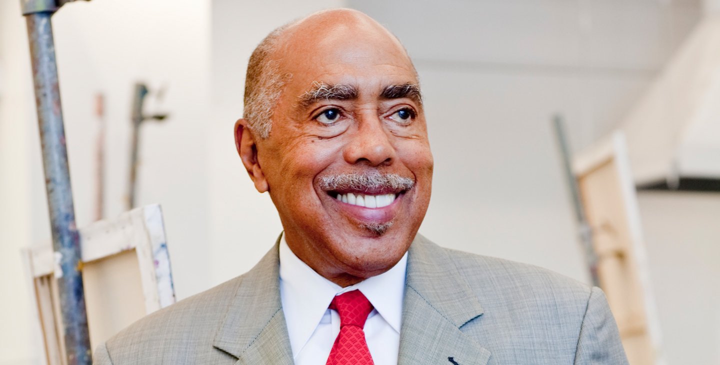 Image of a man in a suit looking off-camera