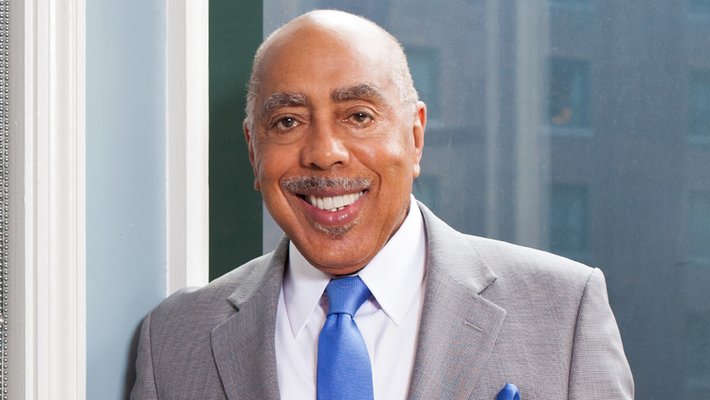 Walter Massey looking at the viewer