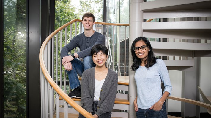 Students Andrew Hess, Myra Cheng, and Nivetha Karthikeyan, founders of the TechReach club, sit in the Annenberg Center for Information Science and Technology.