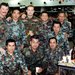 Oliver Mueller (center, top row) served eight years in the U.S. Army Reserve as a first lieutenant and detachment commander of a movement control team after earning an Army ROTC scholarship to pay for college. The photo was taken in Japan during a j