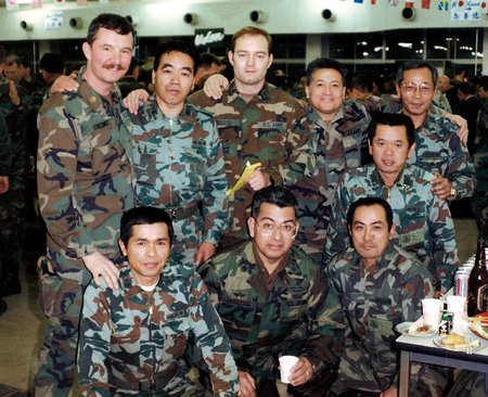 Oliver Mueller (center, top row) served eight years in the U.S. Army Reserve as a first lieutenant and detachment commander of a movement control team after earning an Army ROTC scholarship to pay for college. The photo was taken in Japan during a j