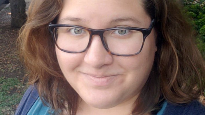 Close-up portrait of Olivia Wilkins outdoors