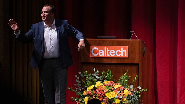 Hosea Nelson (PhD '13), walking onto stage