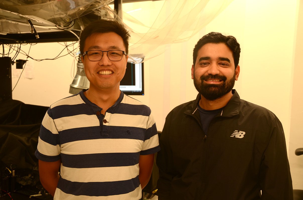 two researchers in an imaging lab space