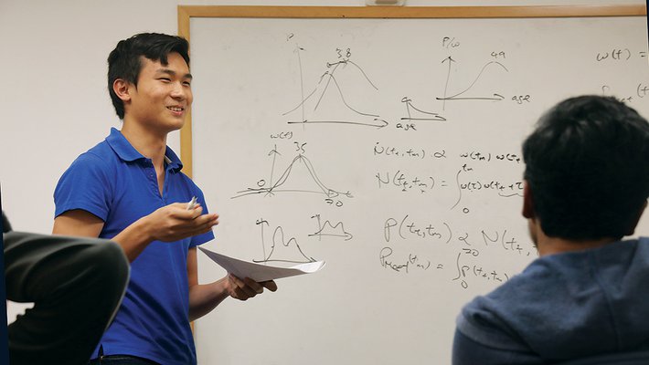 photo of Daniel Mark at a white board