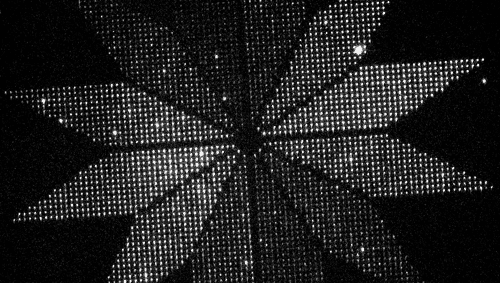 glowing nanoscale molecular devices arranged into a flower shape