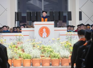 Thomas F. Rosenbaum speaking at Commencement podium