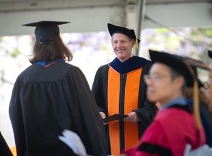 Thomas F. Rosenbaum wearing commencement regalia