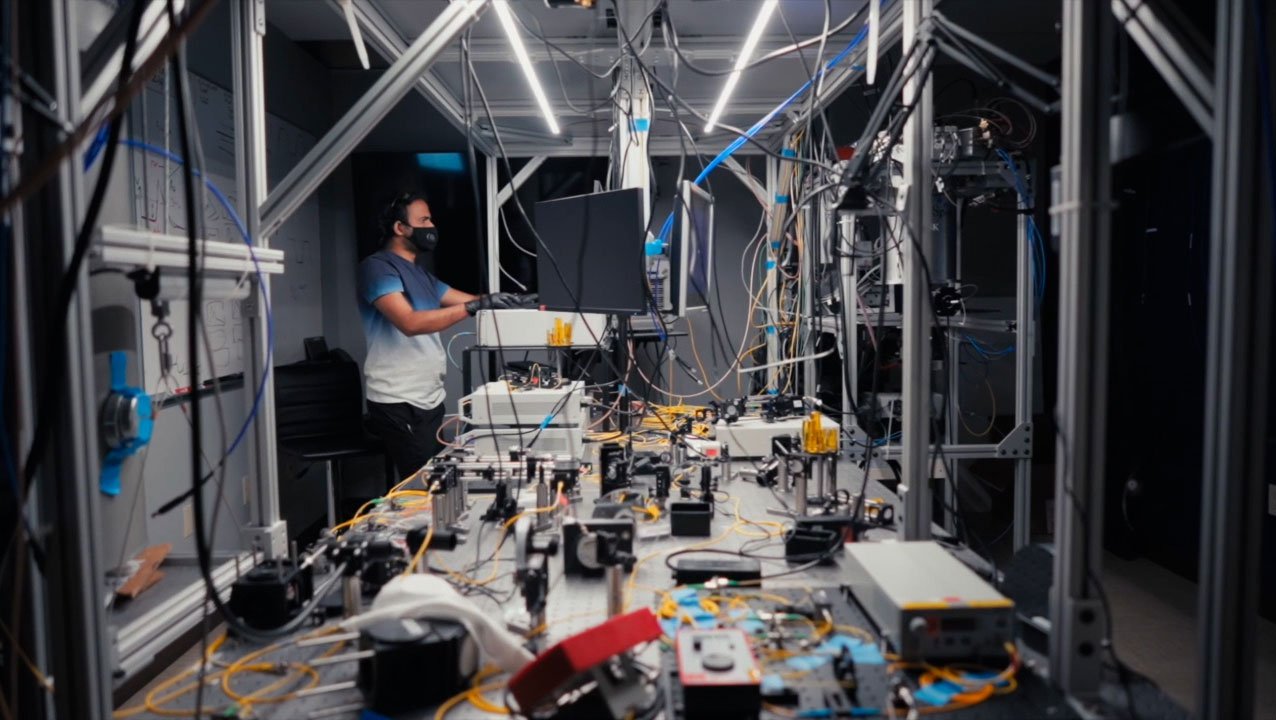 Raju Valivarthi calibrating one of the quantum teleportation nodes