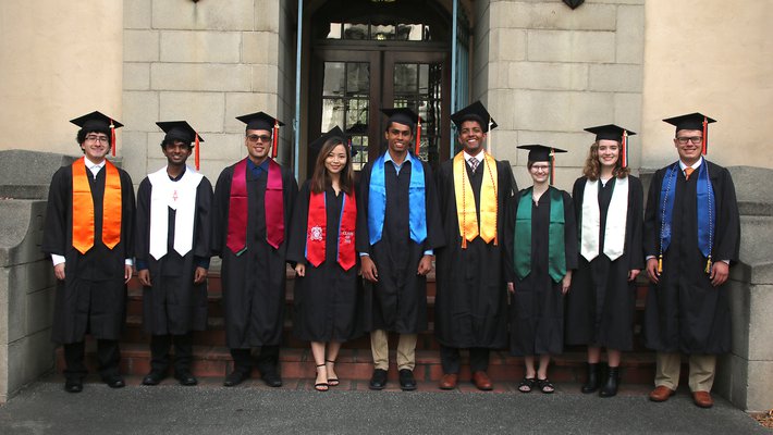 Photo showing the different types of academic regalia worn by graduating Caltech students.