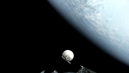 Cone-shaped SPHEREx in space in front of Earth.