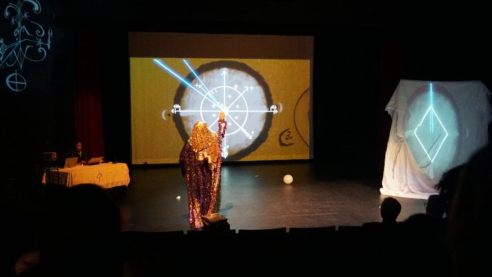 Meena Murugesan (left, behind table) and d. Sabela grimes (center) in "Parable of the Pathmakers"