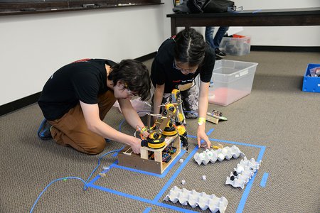 At the 2016 Science Olympiad event at Caltech, participants from Canyon Crest Academy set up a robotic arm.
