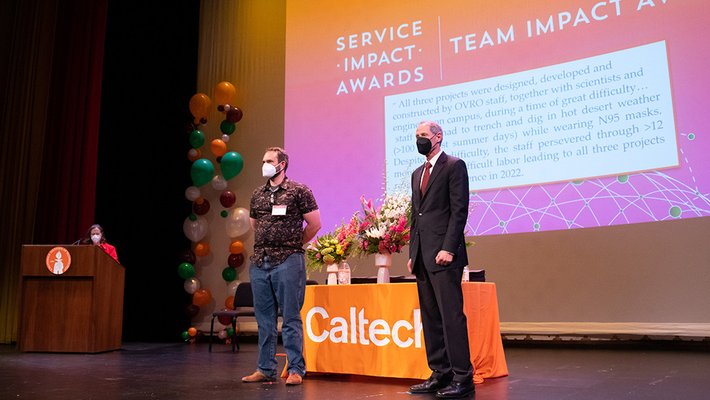 Morgan Catha accepts the Team Impact Award on behalf of ORVO.