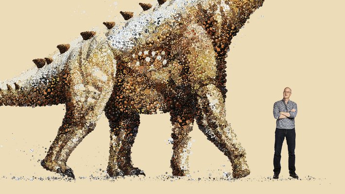 John Eiler standing next to a dinosaur