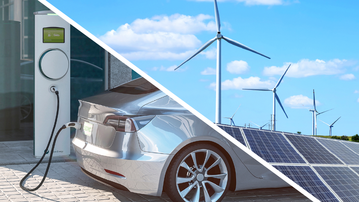 electric vehicle at charging station and wind turbines