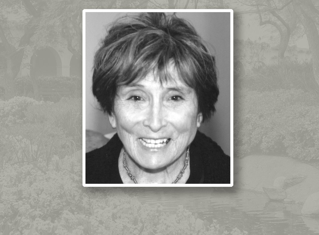 Headshot of Annette J. Smith. She has short dark hair and is wearing a necklace.