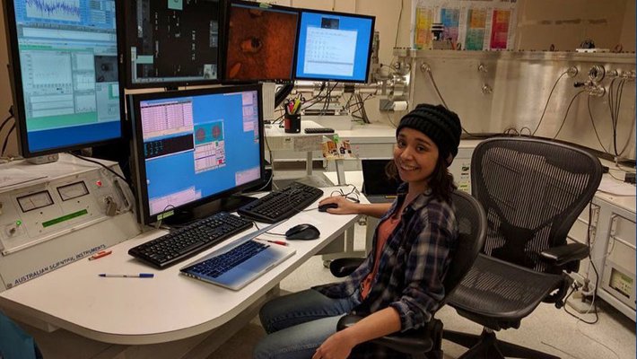 Graduate student Emma Sosa sits works at a computer at Caltech
