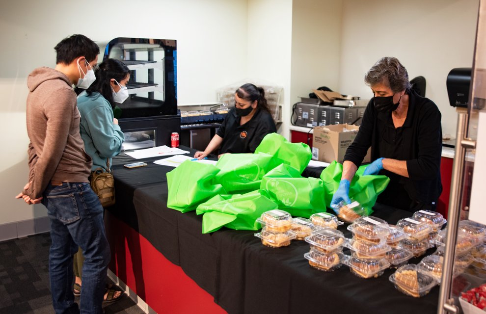 Caltech graduate students picking up Thanksgiving dinner to-go