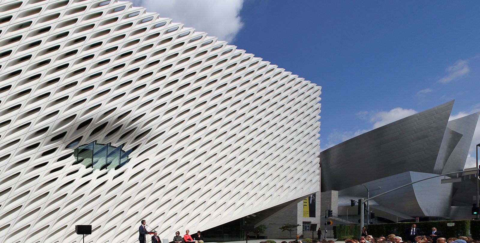 Former LA Mayor Eric Garcetti speaks at the opening of the Broad with Disney Hall in the distance