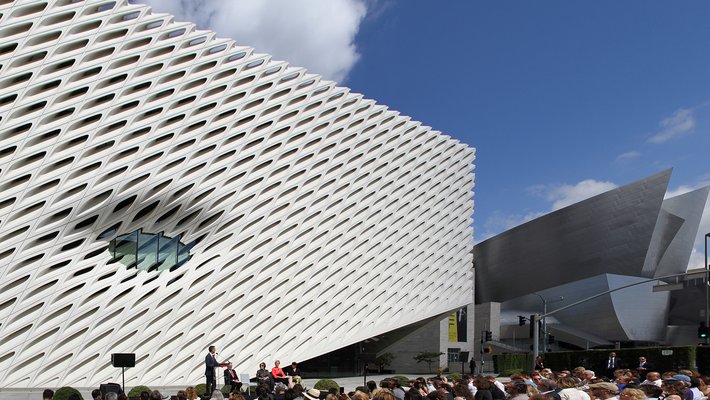 Former LA Mayor Eric Garcetti speaks at the opening of the Broad with Disney Hall in the distance