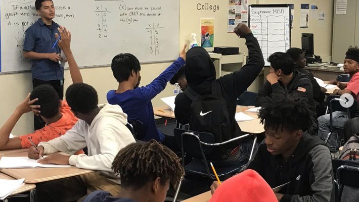A class full of students sitting at desks